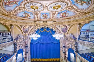 Elegant view of the ornate interior of the Grand Theatre, showcasing detailed architecture.