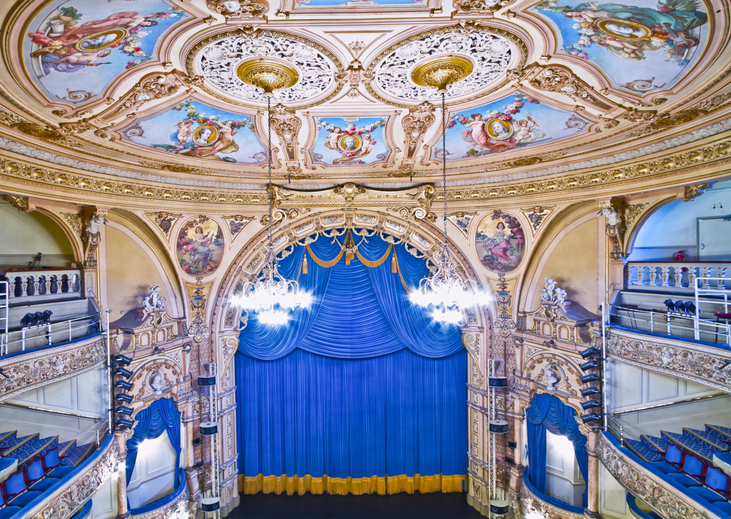 Elegant view of the ornate interior of the Grand Theatre, showcasing detailed architecture.