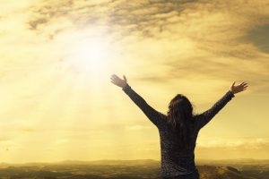 woman, sky, sunlight, arms, open arms, sunbeams, sunrays, clouds, nature, worship, freedom, happiness, relieved, prayer, praise, success, joy